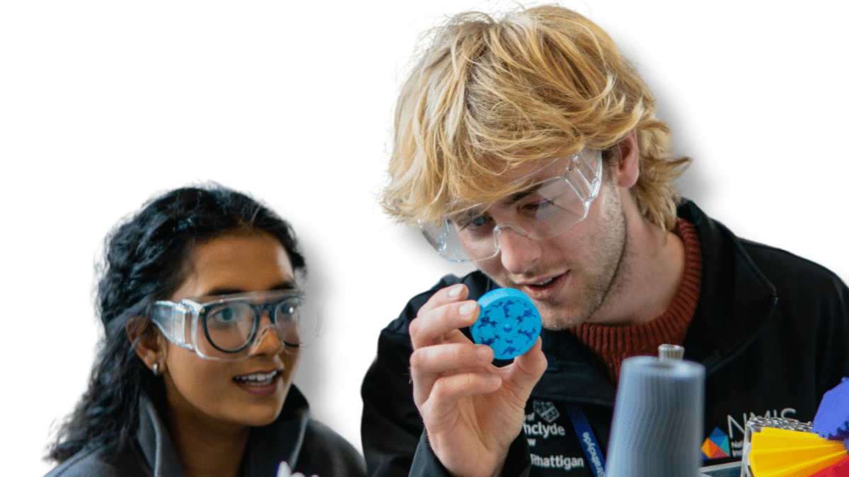 young male and female engineer examining an object