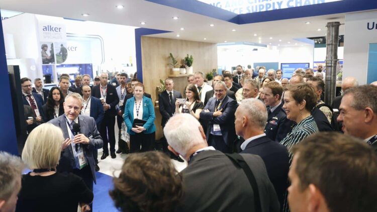 Group of conference delegates watching an interview